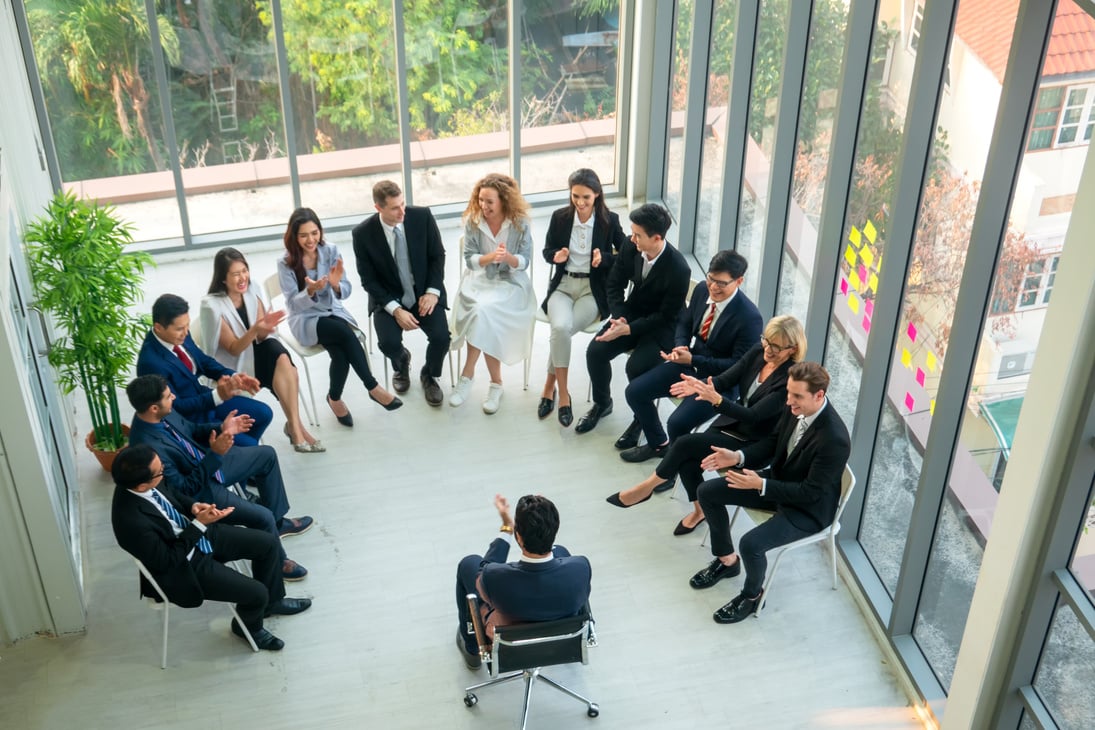 Group of People in  Business Corporate Event Clapping their Hands